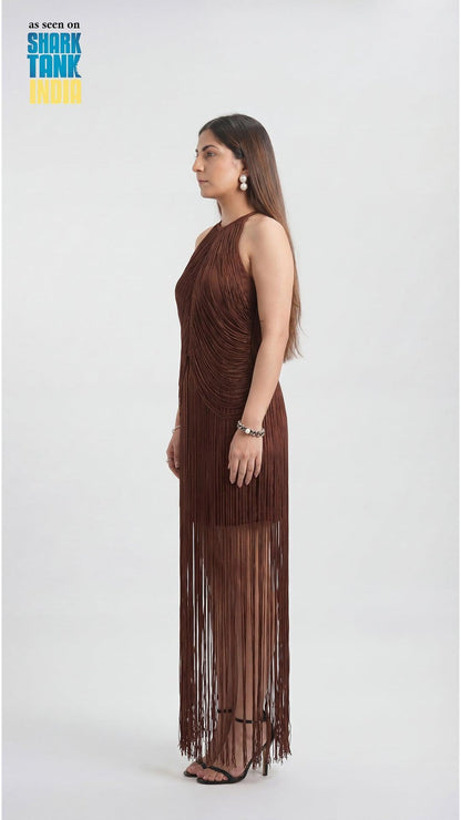 Woman wearing a brown fringe dress on a white background with Shark Tank branding.
