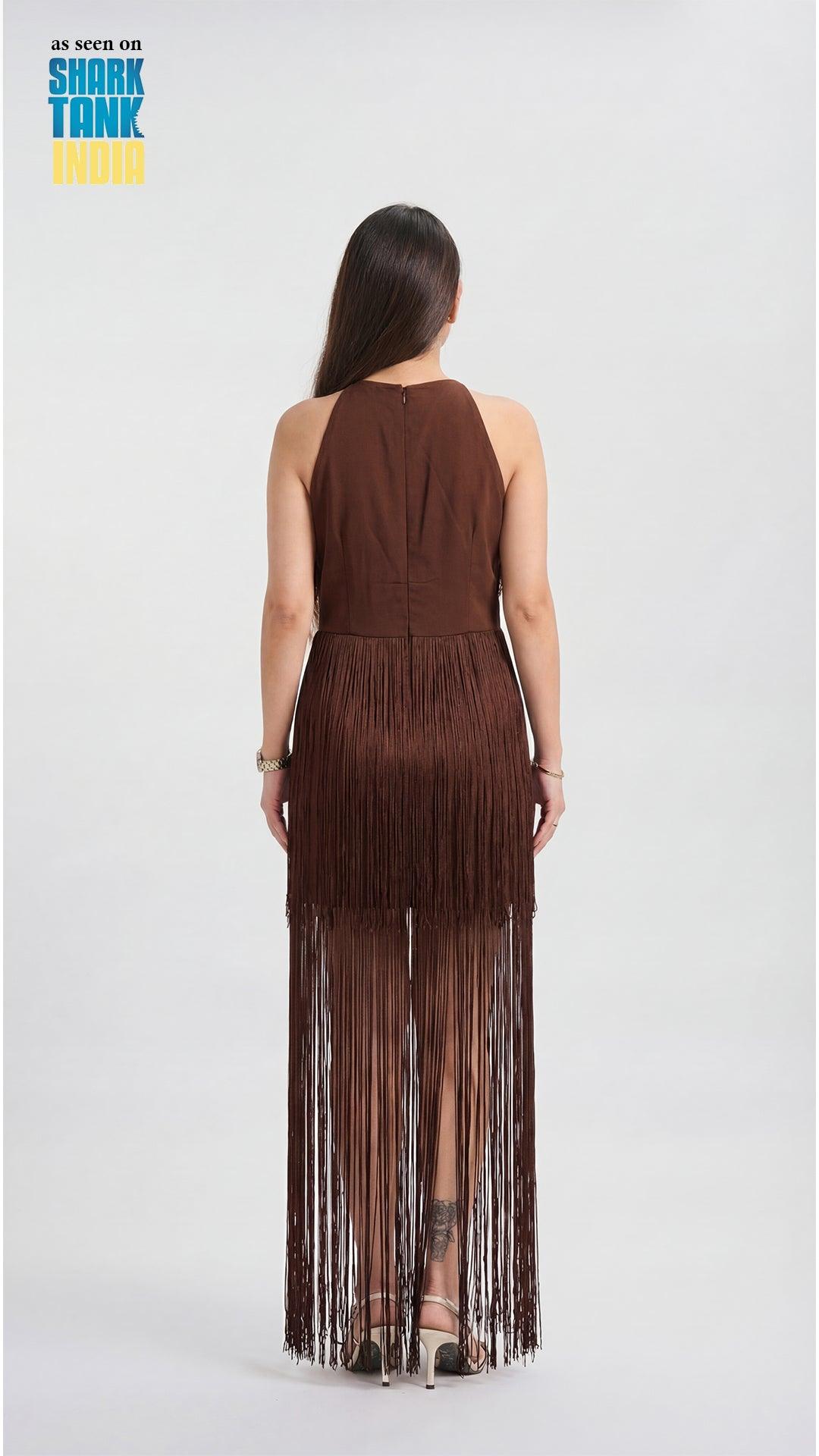 Woman wearing a brown fringe dress on a white background with 'Shark Tank' branding.