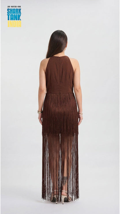 Woman wearing a brown fringe dress on a white background with 'Shark Tank' branding.