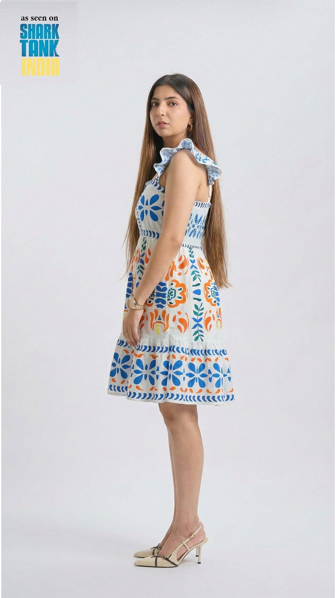 Woman wearing a colorful floral dress on a white background