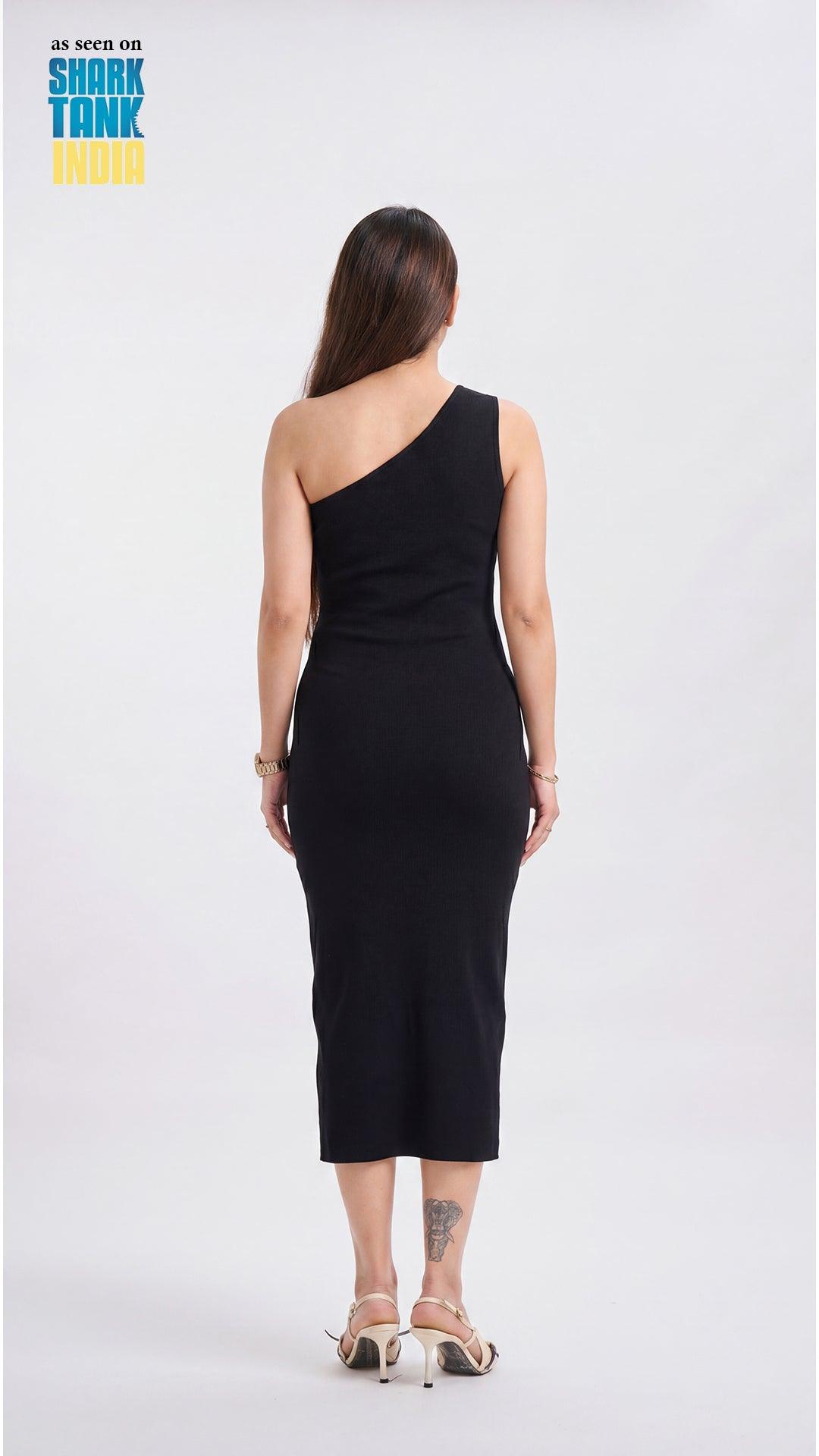 Woman wearing a black one-shoulder dress on a white background with 'Shark Tank' branding.