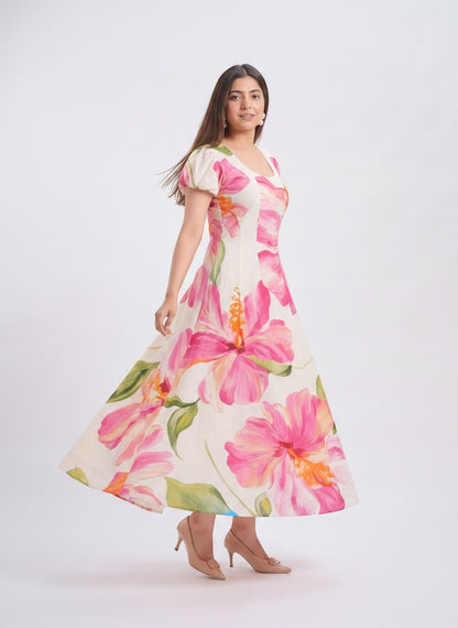 TBFO floral print maxi dress with puff sleeves and scoop neckline worn by a model in a studio setting