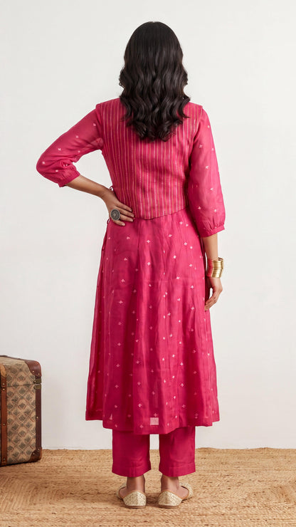 Woman wearing a pink traditional outfit with a white background