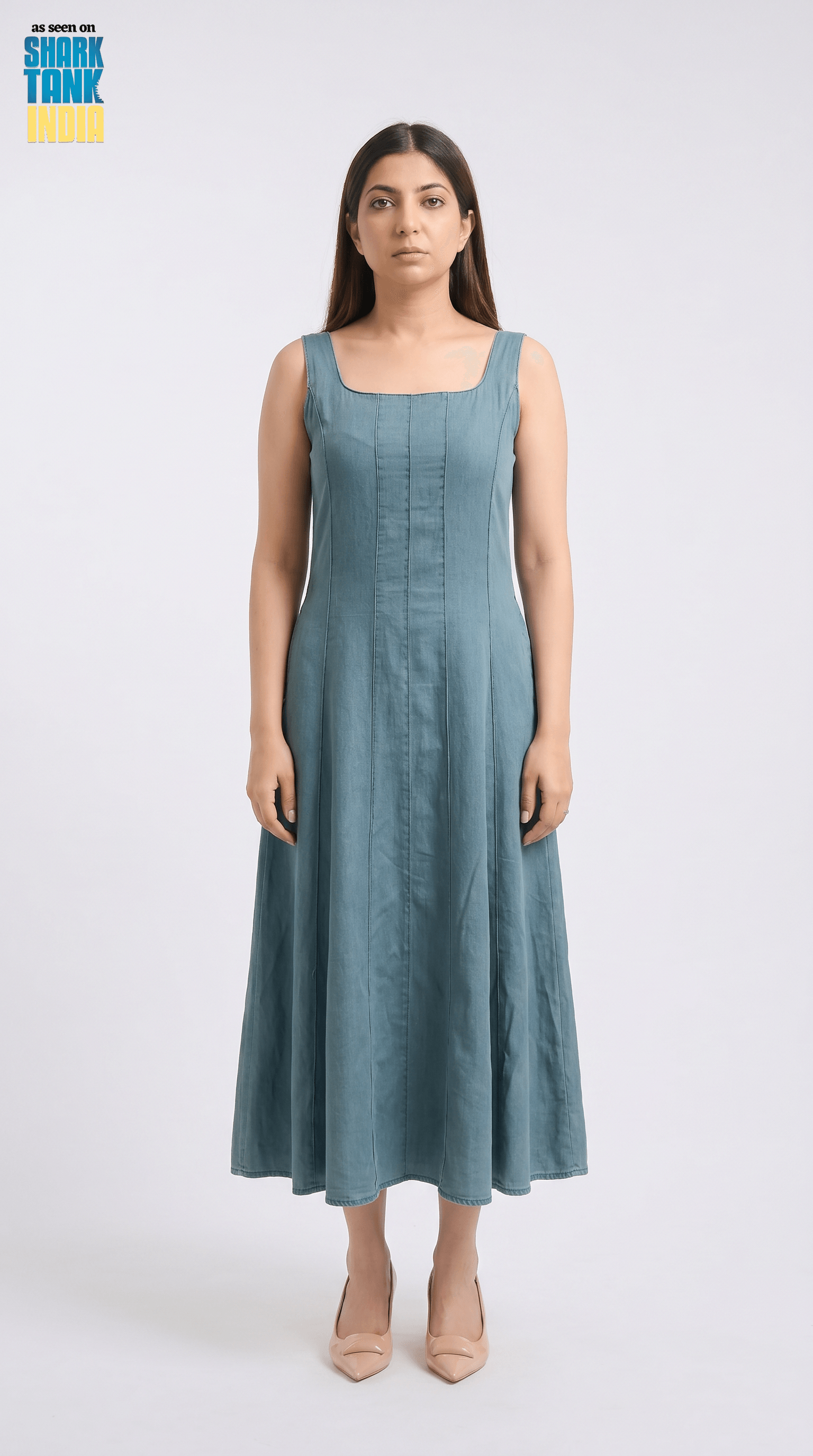 Woman wearing a blue dress on a white background