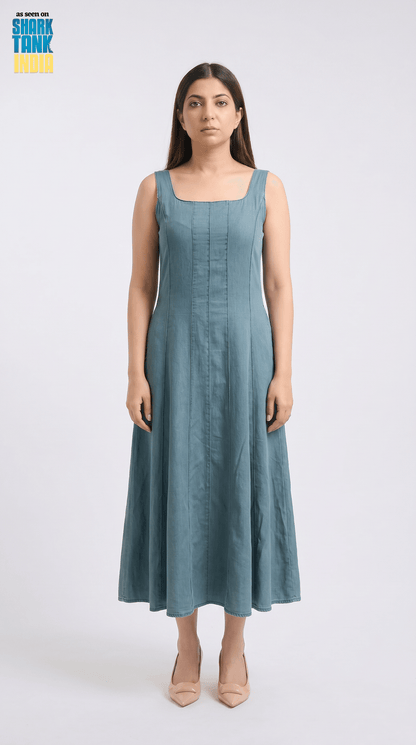 Woman wearing a blue dress on a white background