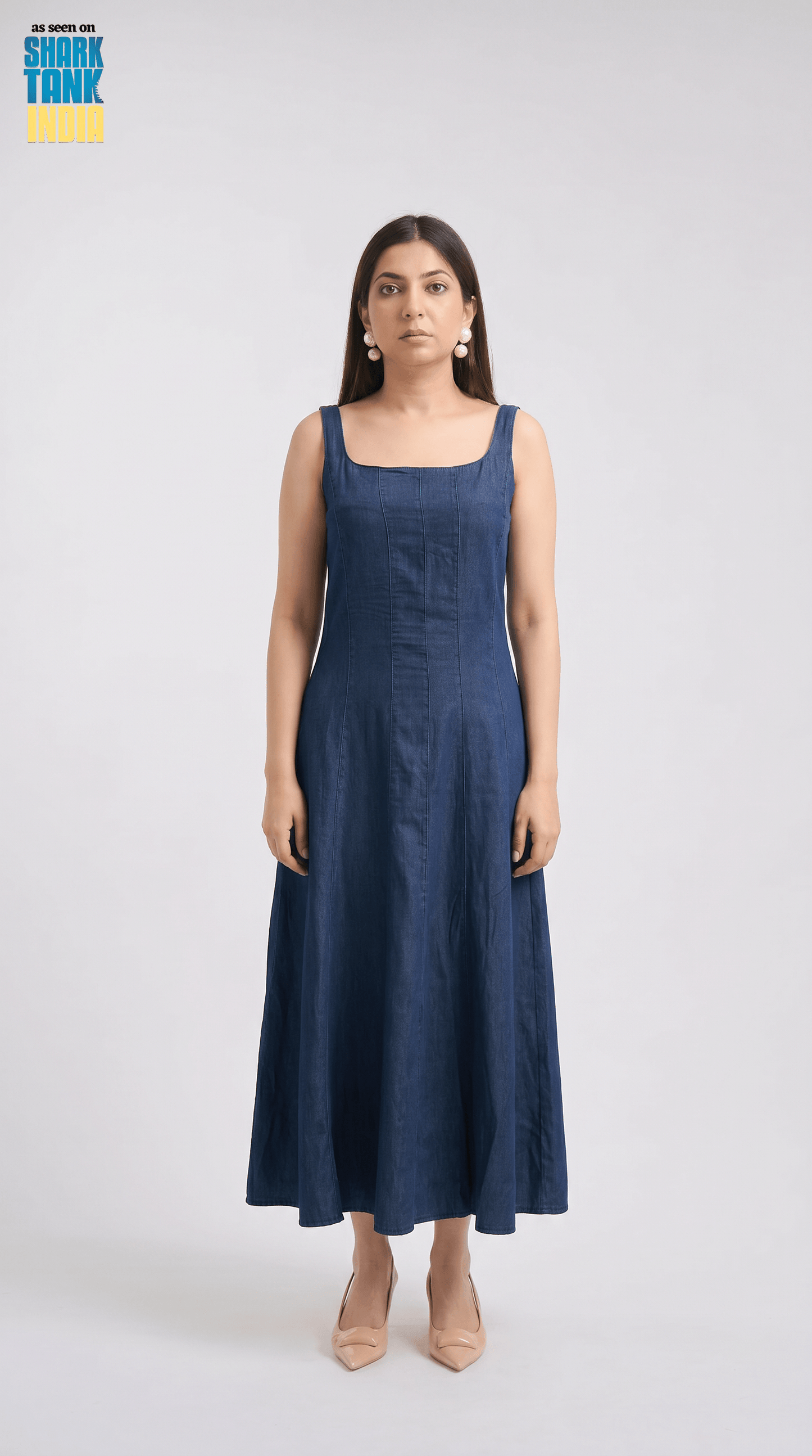 Woman wearing a blue dress on a white background