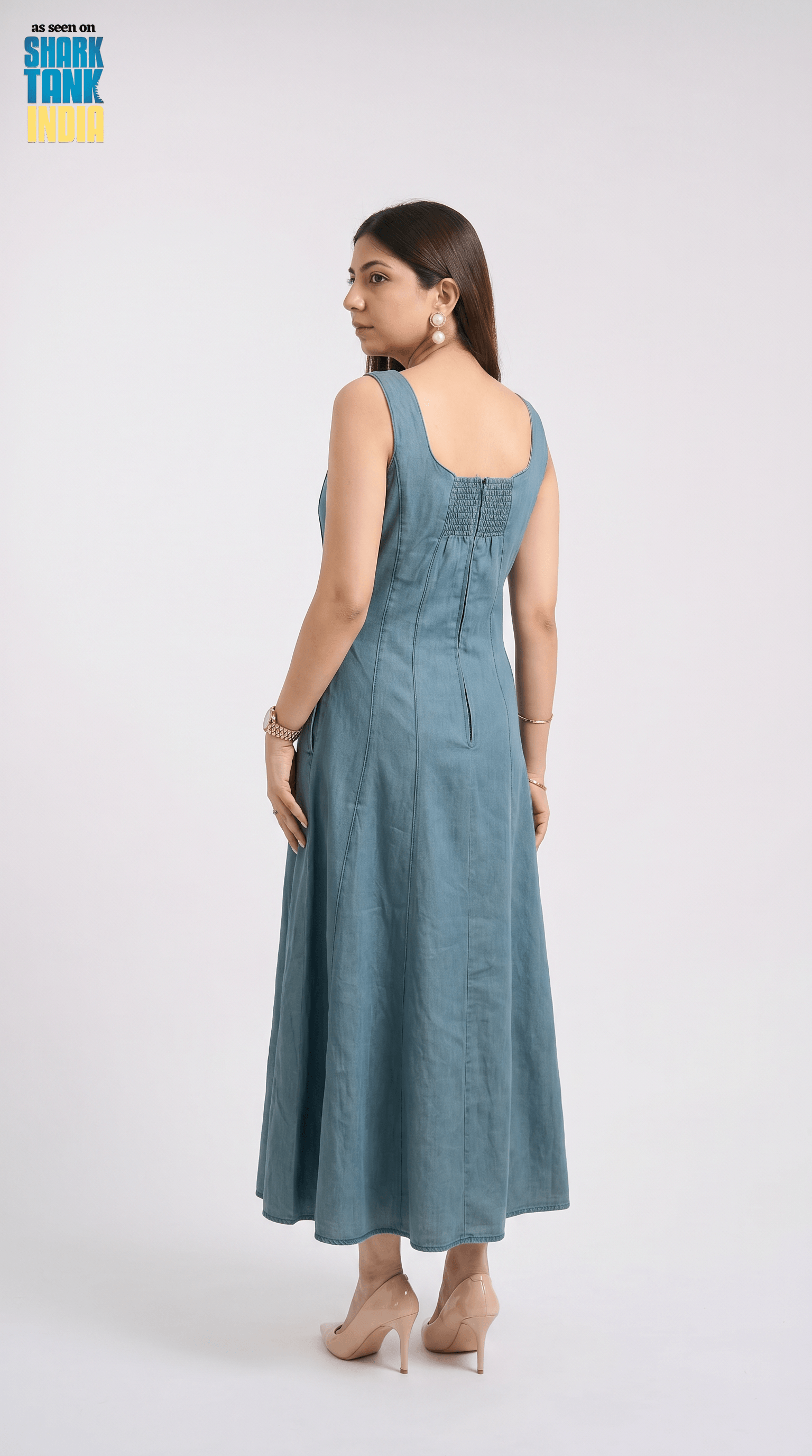 Woman wearing a blue dress on a white background