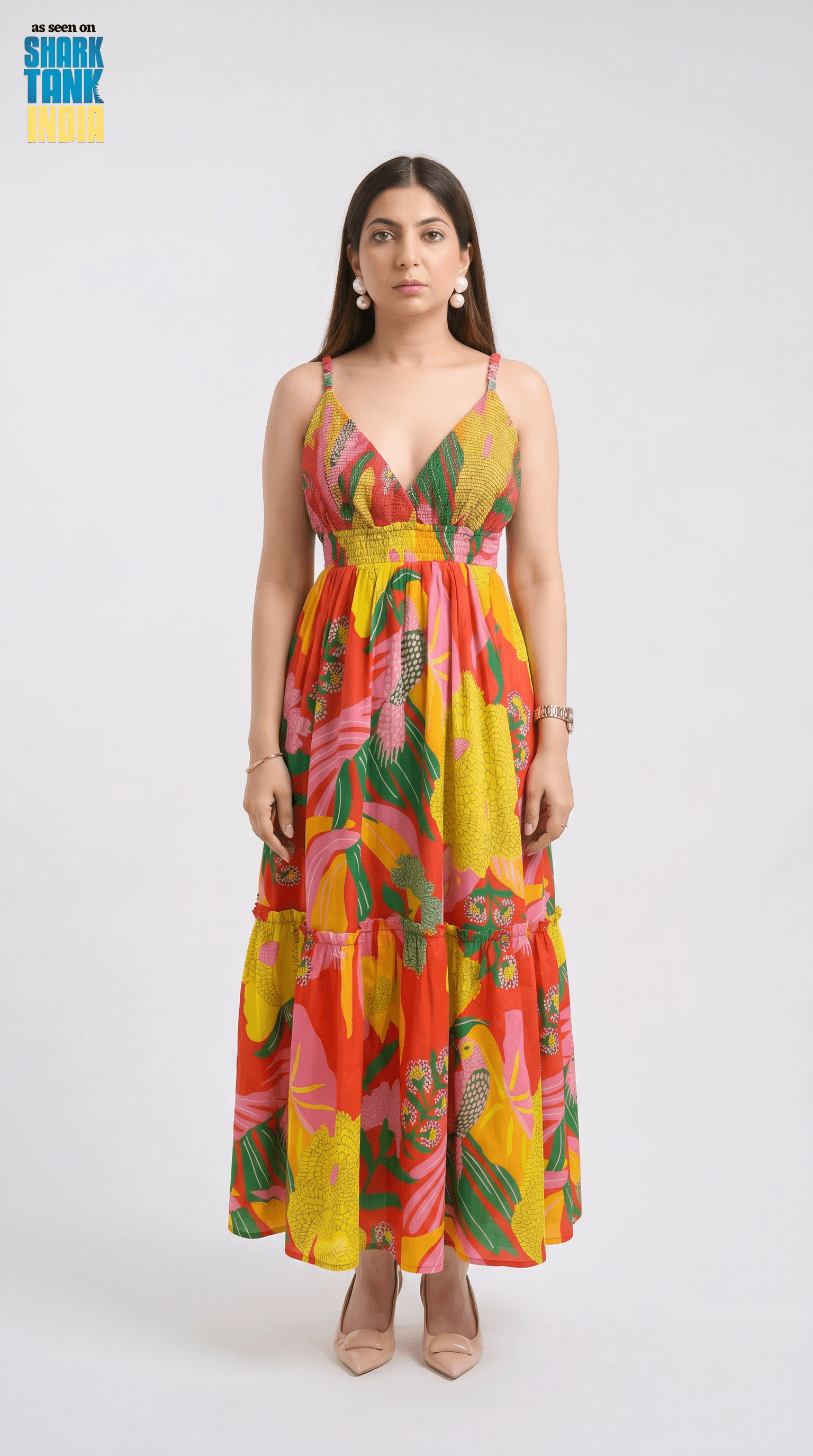 Woman wearing a colorful floral dress on a white background