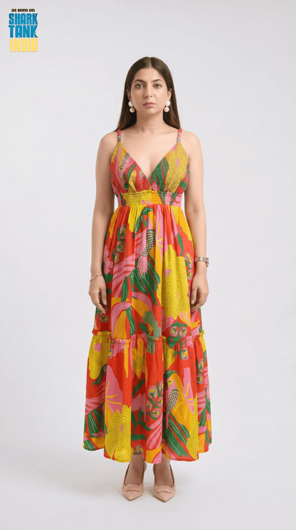 Woman wearing a colorful floral dress on a white background