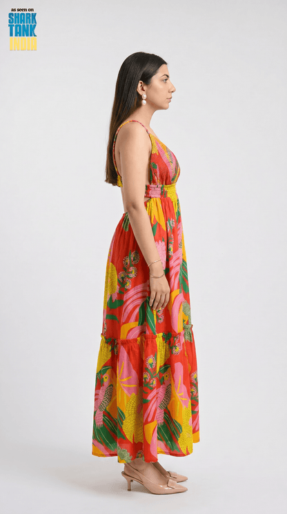 Woman wearing a colorful floral dress on a white background
