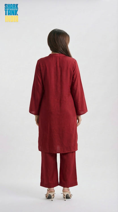 Person wearing a red outfit on a white background