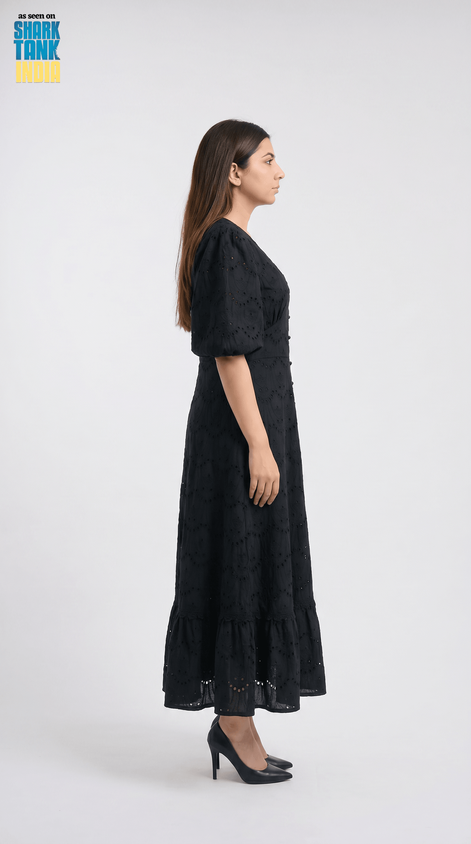 Woman wearing a black dress on a white background
