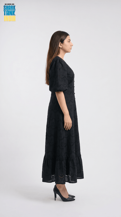 Woman wearing a black dress on a white background