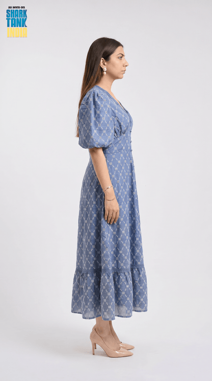 Woman wearing a blue polka dot dress on a white background
