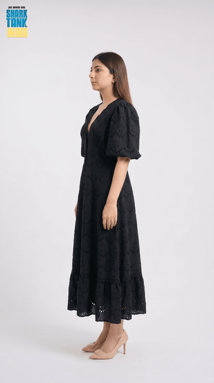 Woman wearing a black dress on a white background