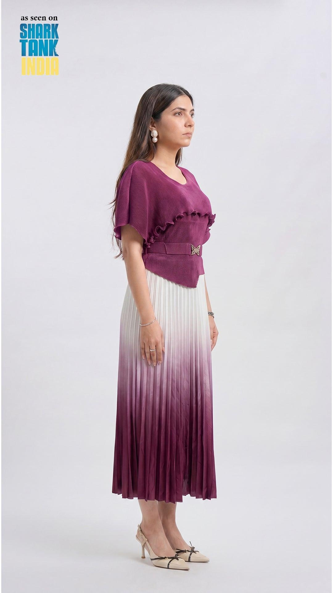 Woman wearing a purple top and gradient skirt on a white background