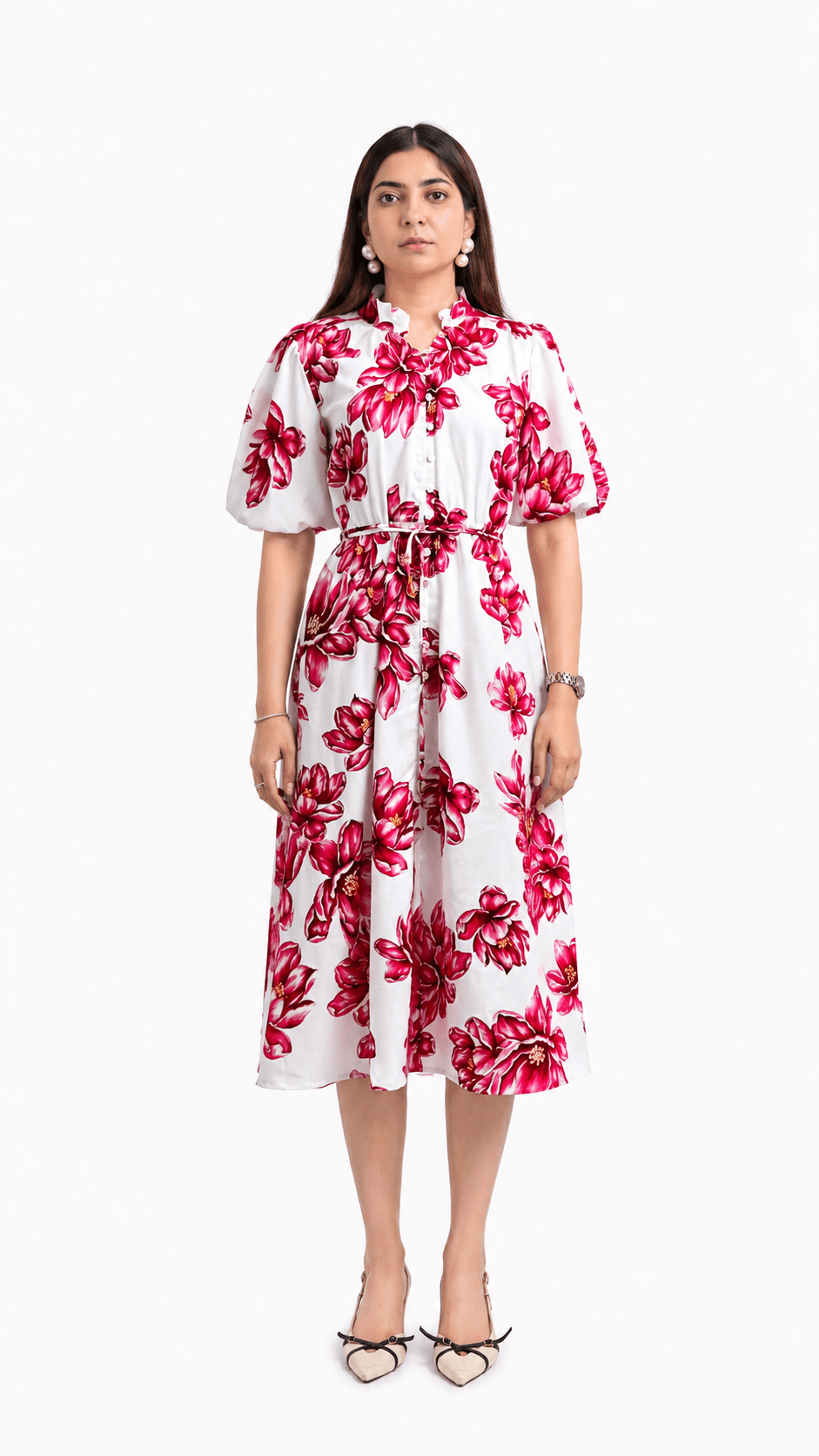 Woman wearing a white dress with red floral pattern on a white background