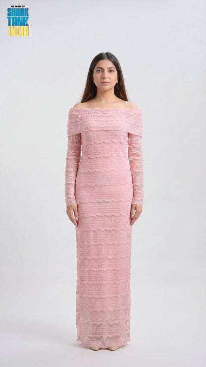 Woman wearing a pink off-shoulder long-sleeve dress on a white background