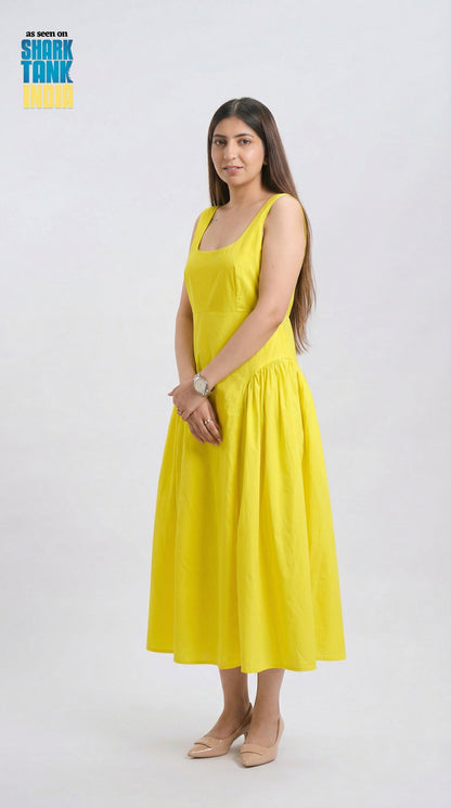 Woman wearing a yellow dress on a white background