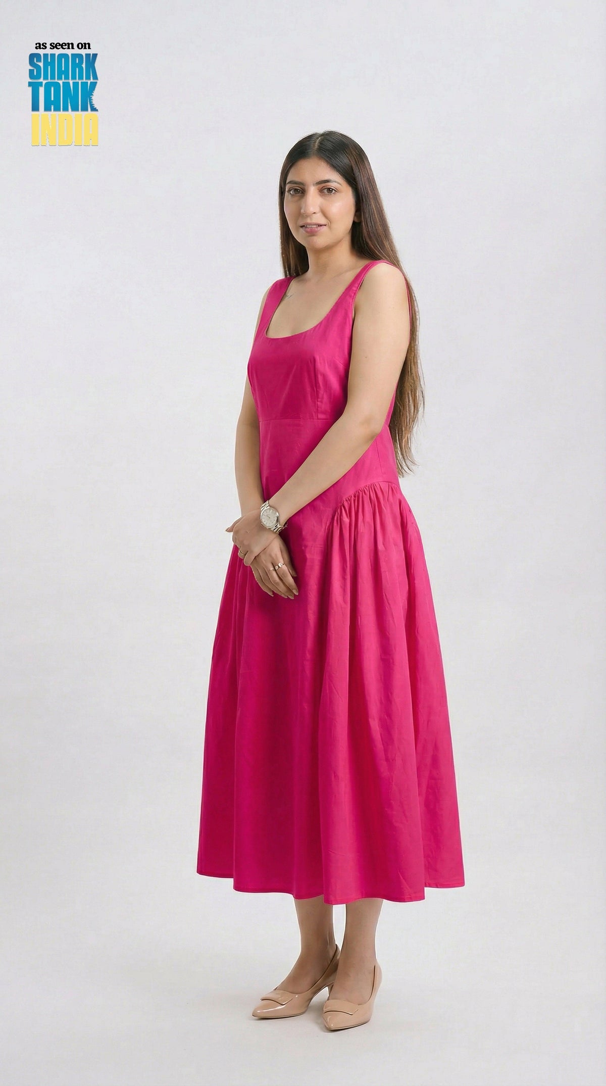 Woman wearing a pink dress on a white background