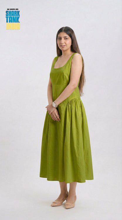 Woman wearing a green dress on a white background
