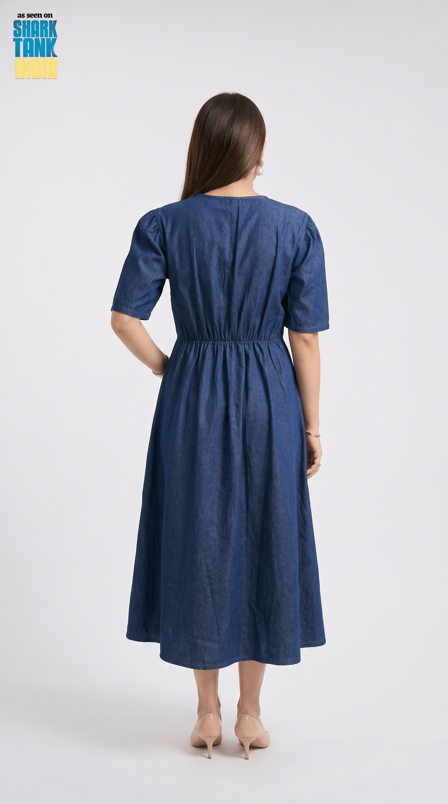 Woman wearing a blue dress on a white background