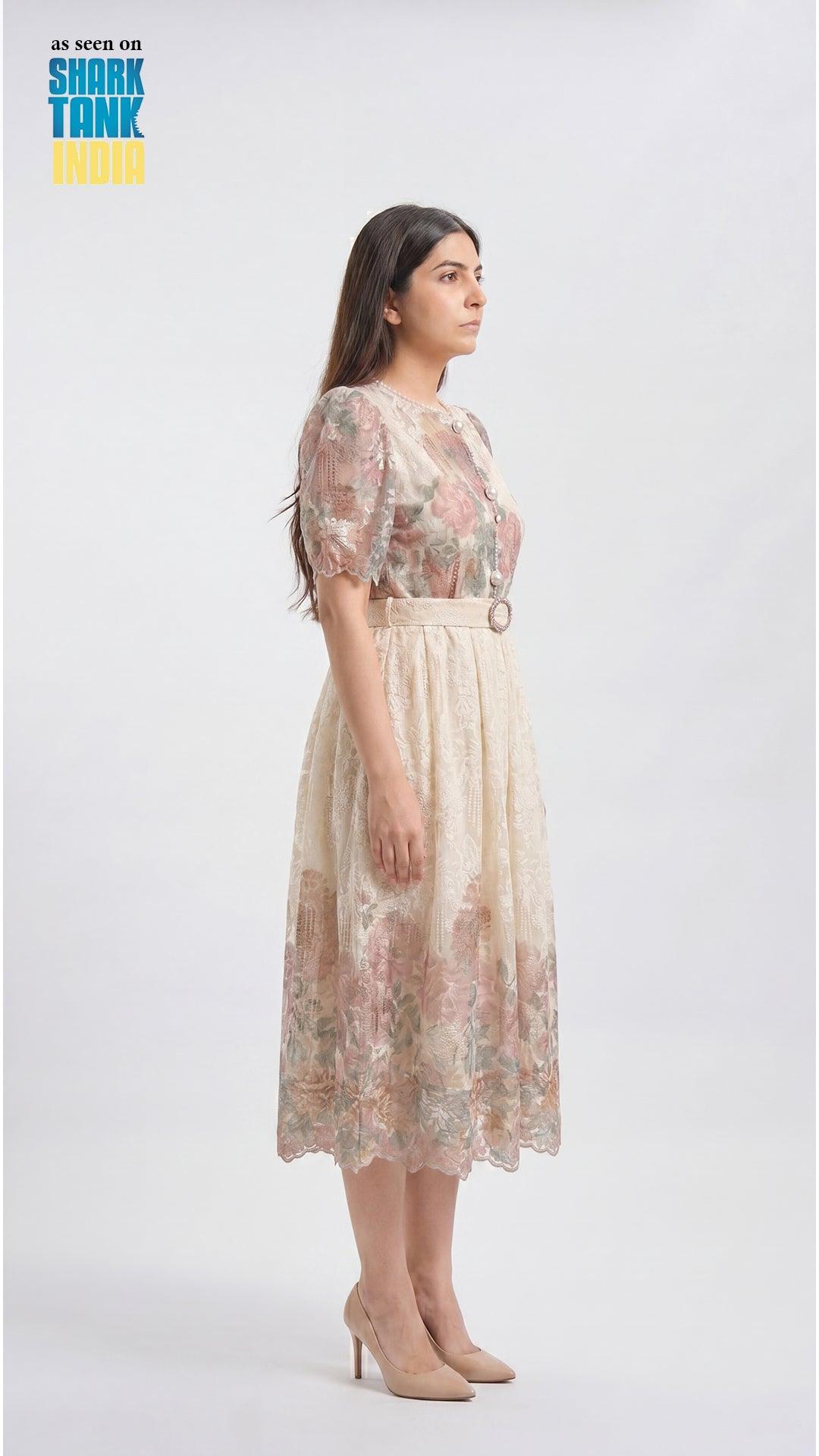 Woman wearing a floral dress on a white background with 'Shark Tank' branding.