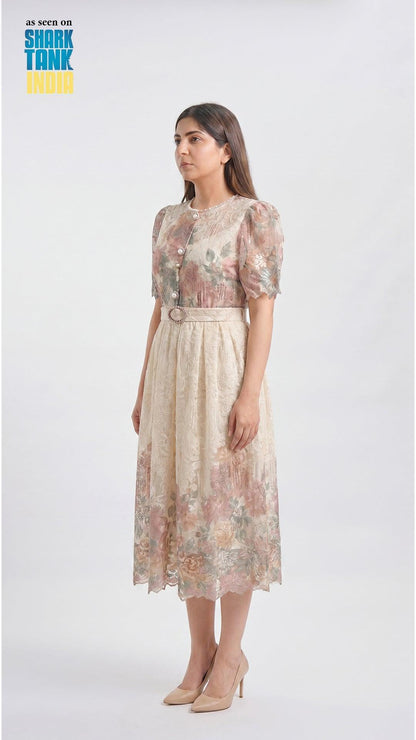 Woman wearing a floral dress on a white background with 'Shark Tank' branding.