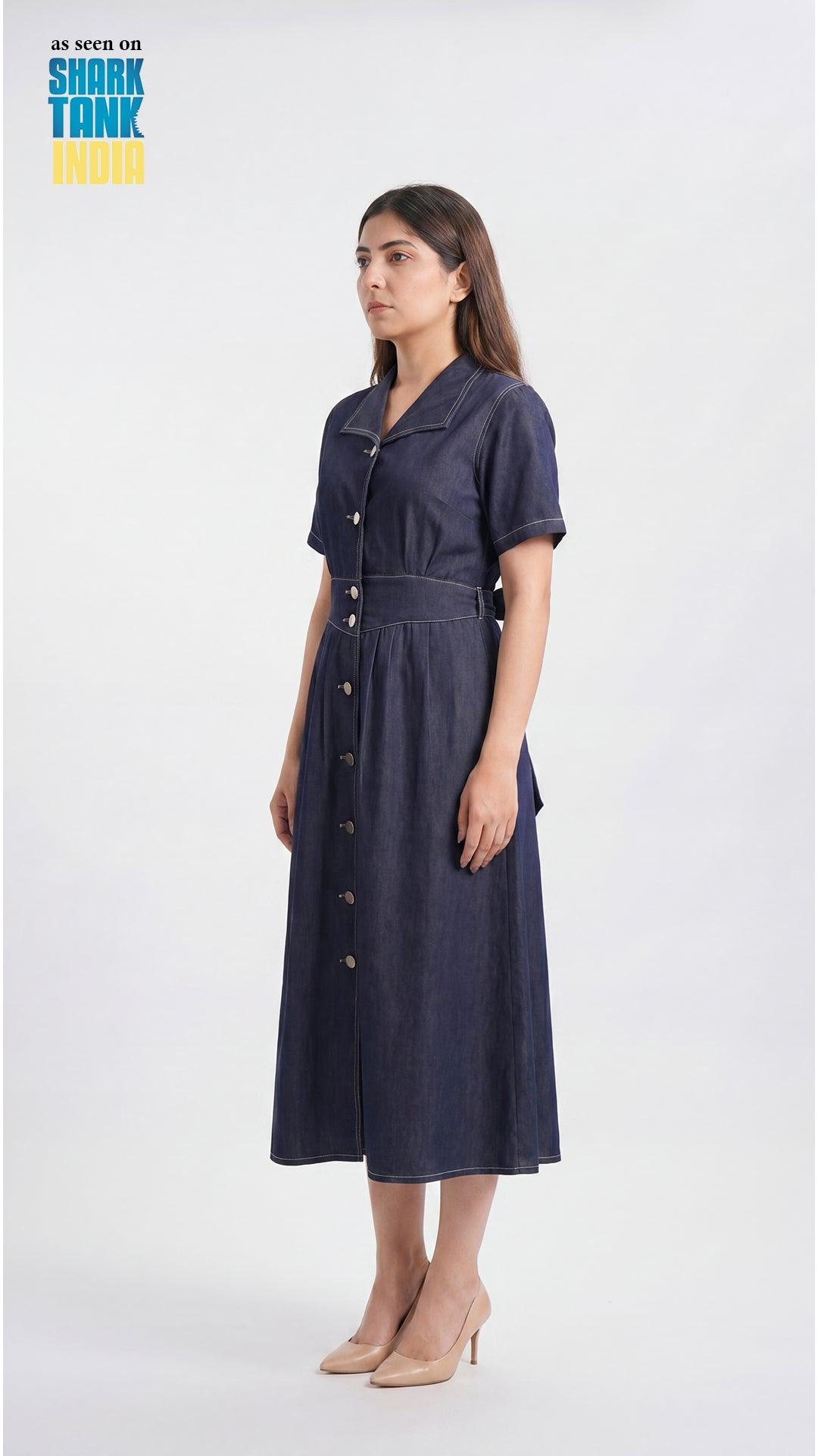 Woman wearing a navy dress on a white background
