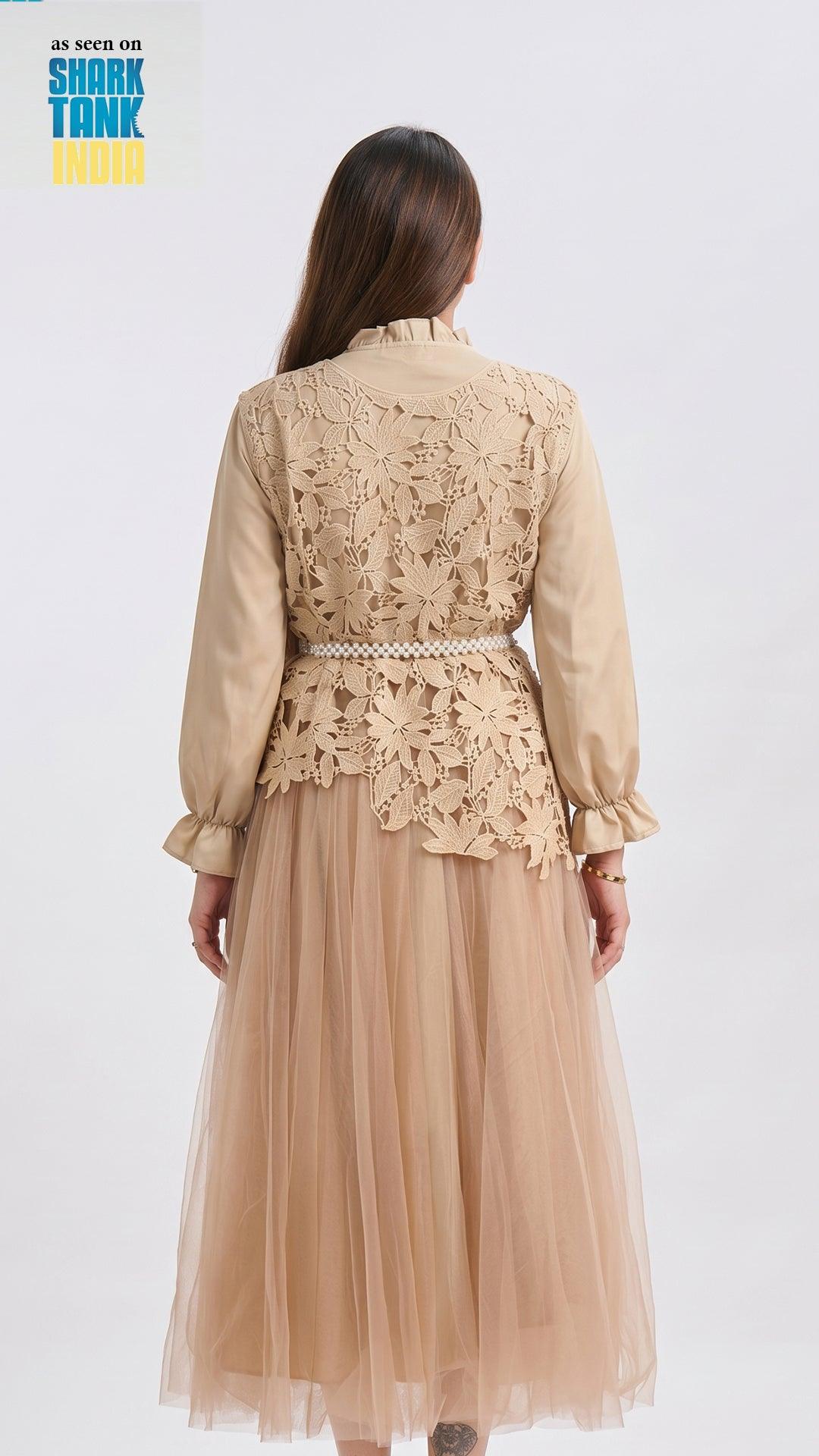 Woman wearing a beige lace top and tulle skirt on a white background