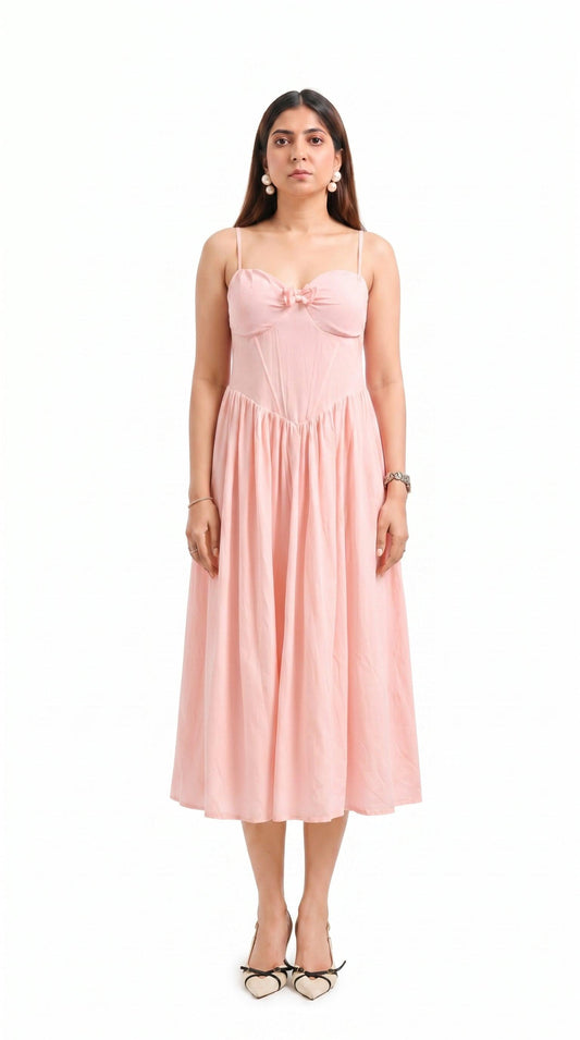 Woman wearing a pink dress on a white background
