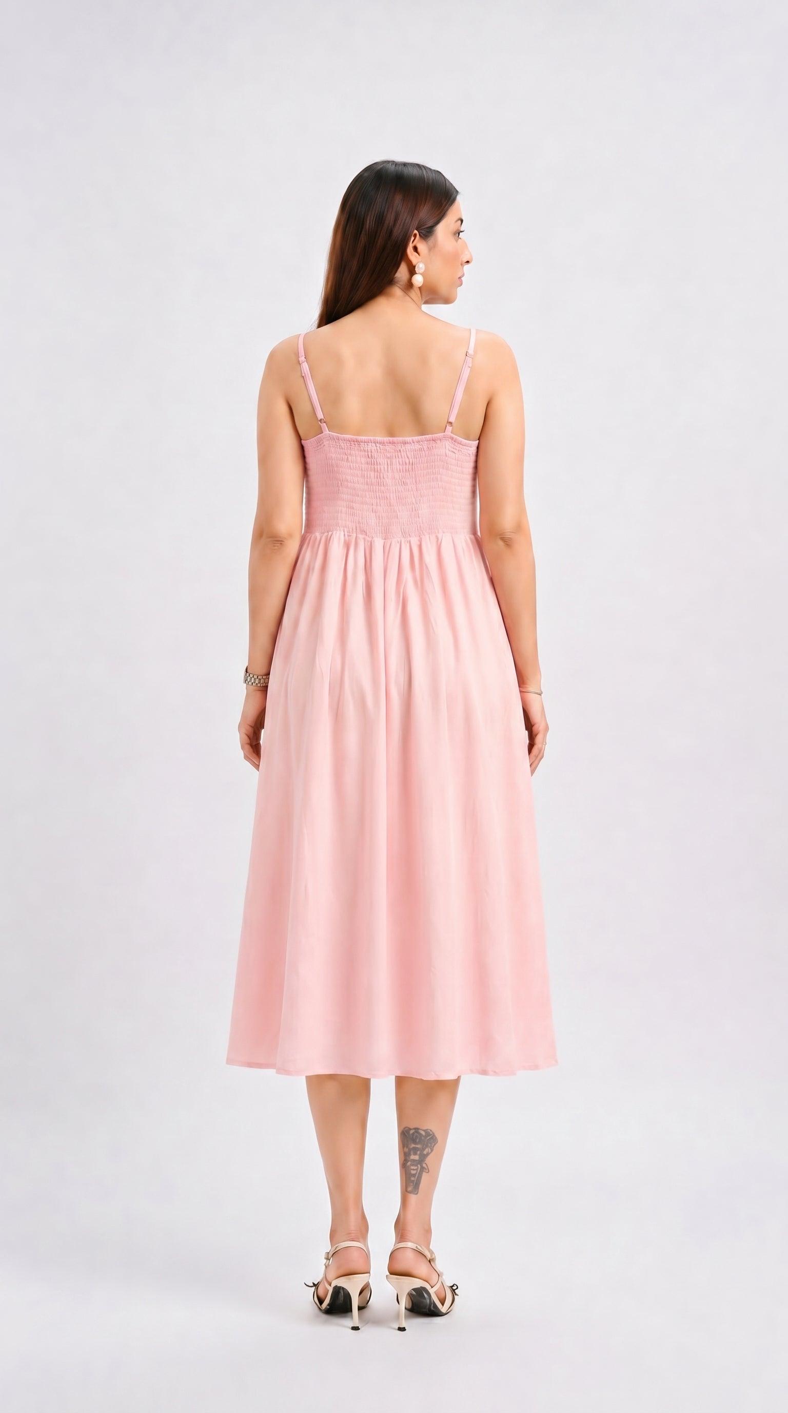 Woman wearing a pink dress on a white background