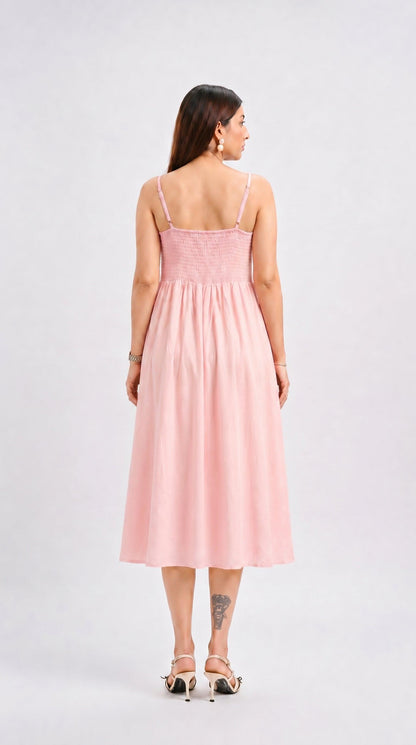 Woman wearing a pink dress on a white background