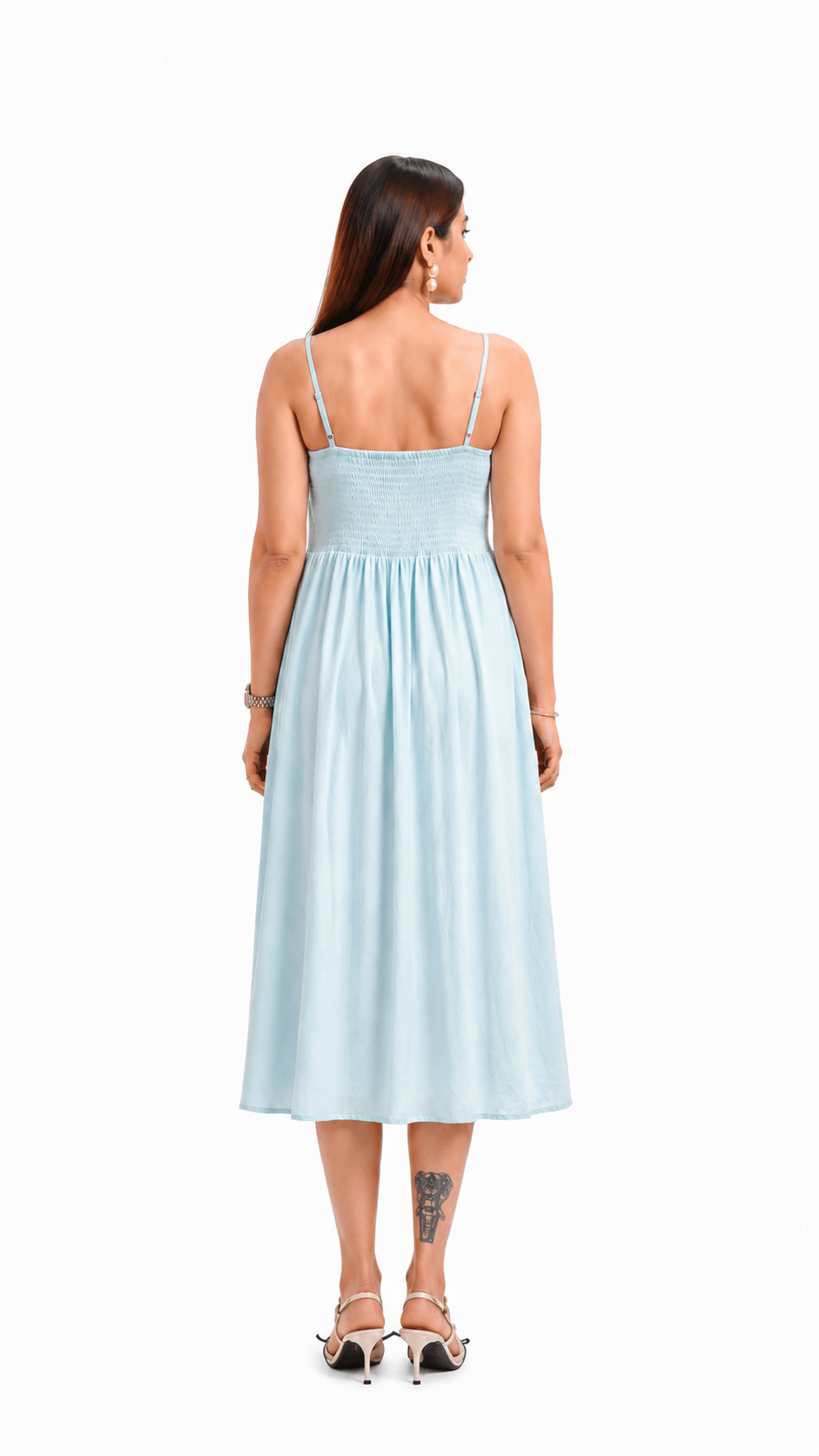 Woman wearing a light blue dress on a white background