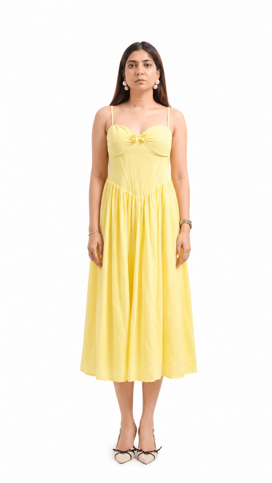 Woman wearing a yellow dress on a white background