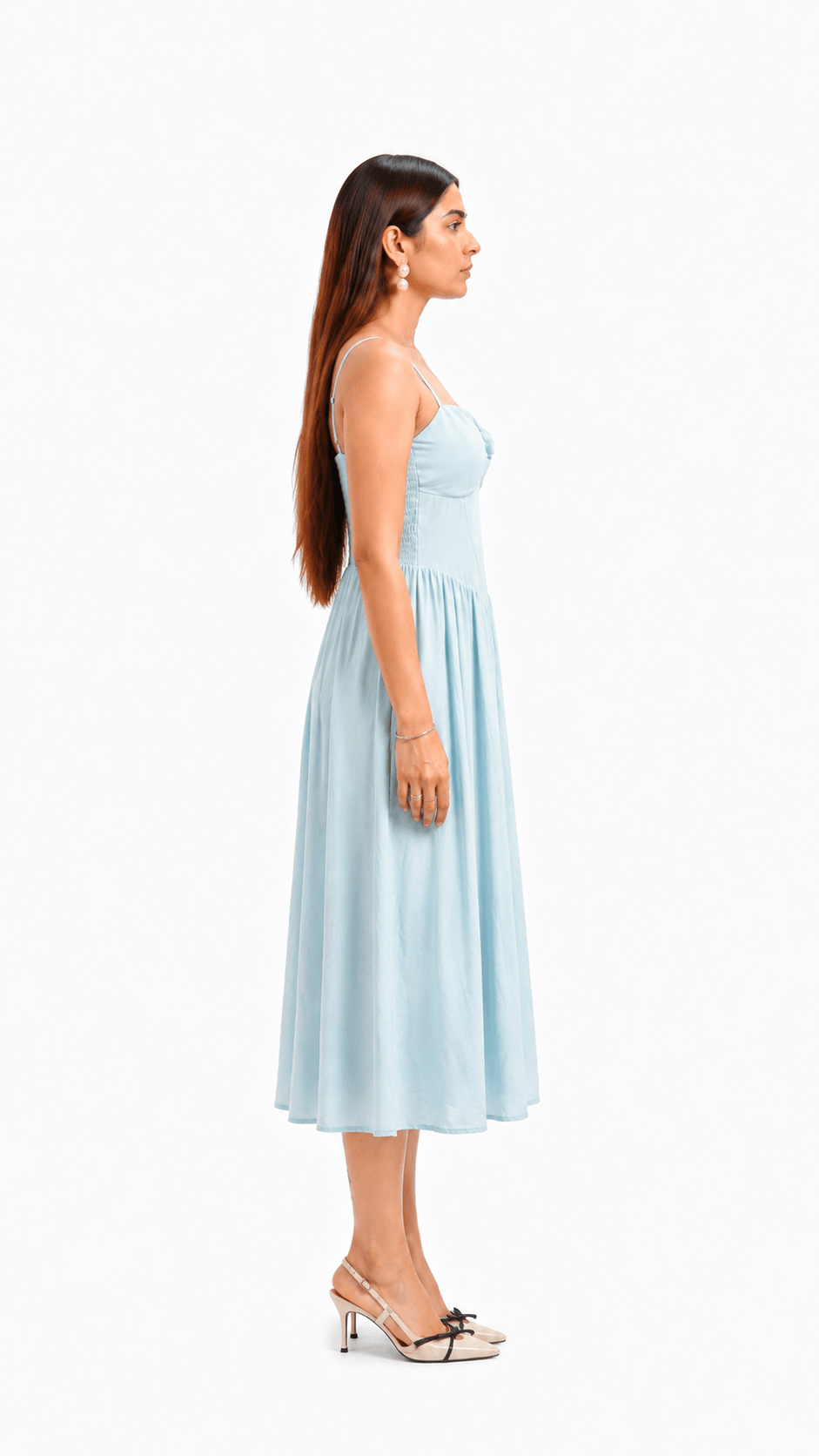 Woman wearing a light blue dress on a white background
