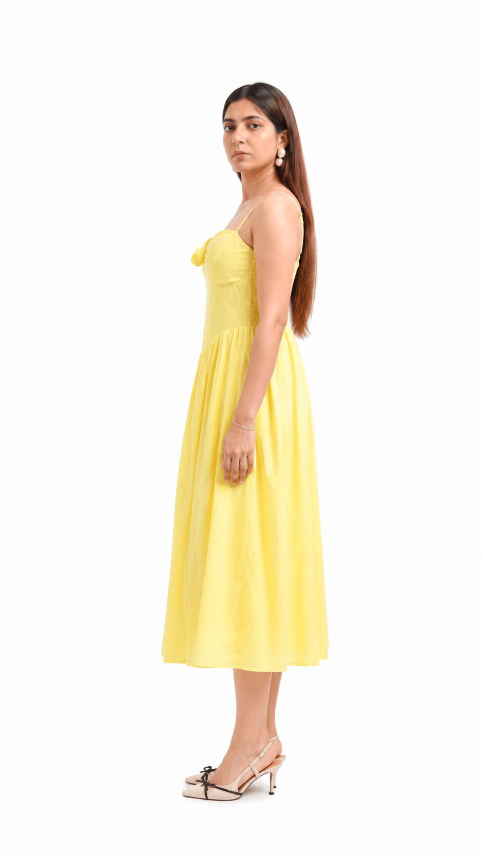 Woman wearing a yellow dress on a white background