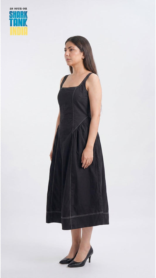 Woman wearing a black dress on a white background