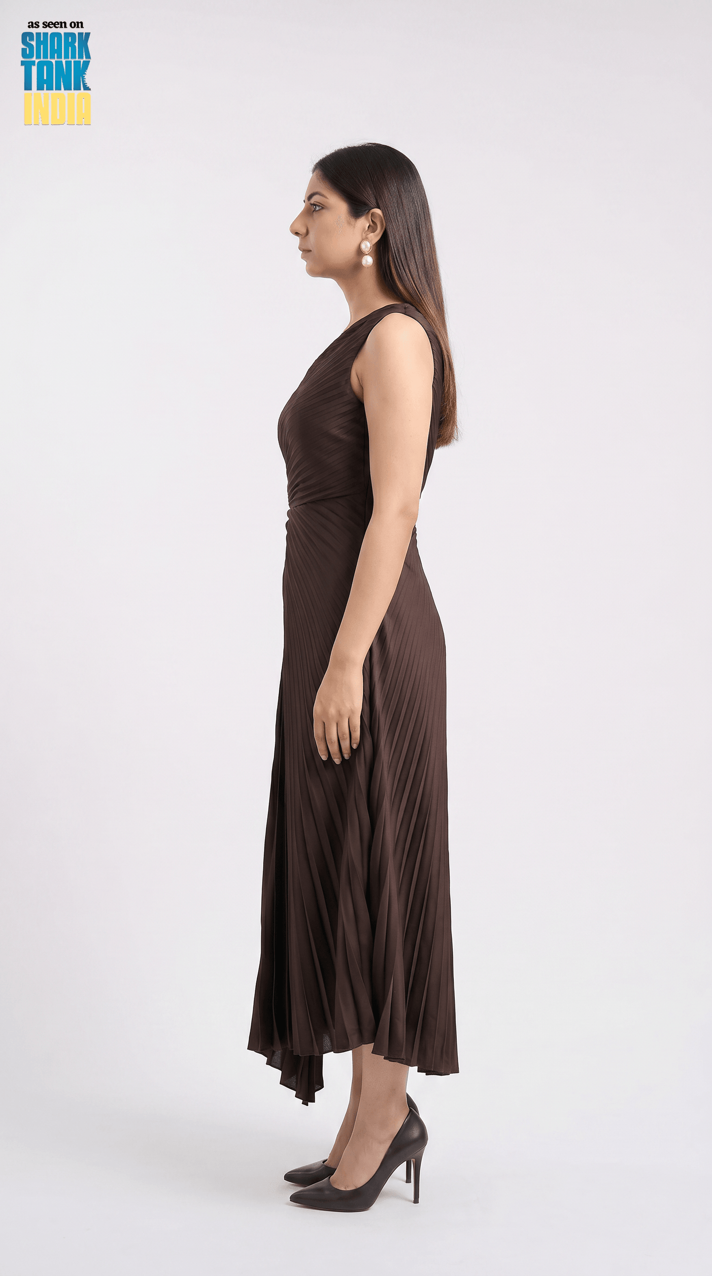 Woman wearing a brown dress on a white background