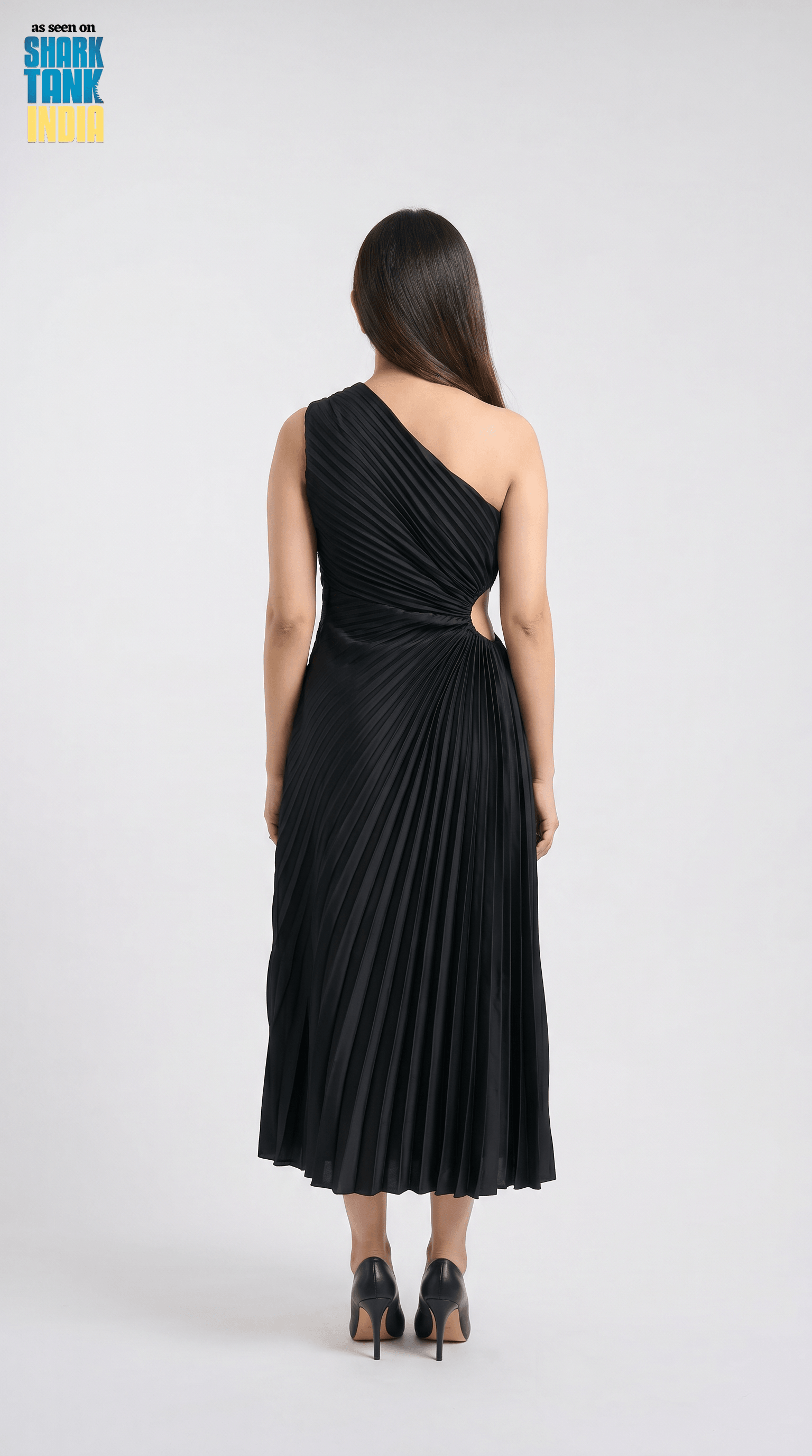 Woman wearing a black one-shoulder dress on a white background