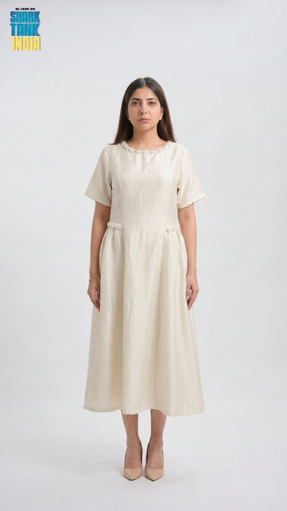 Woman wearing a white dress on a white background