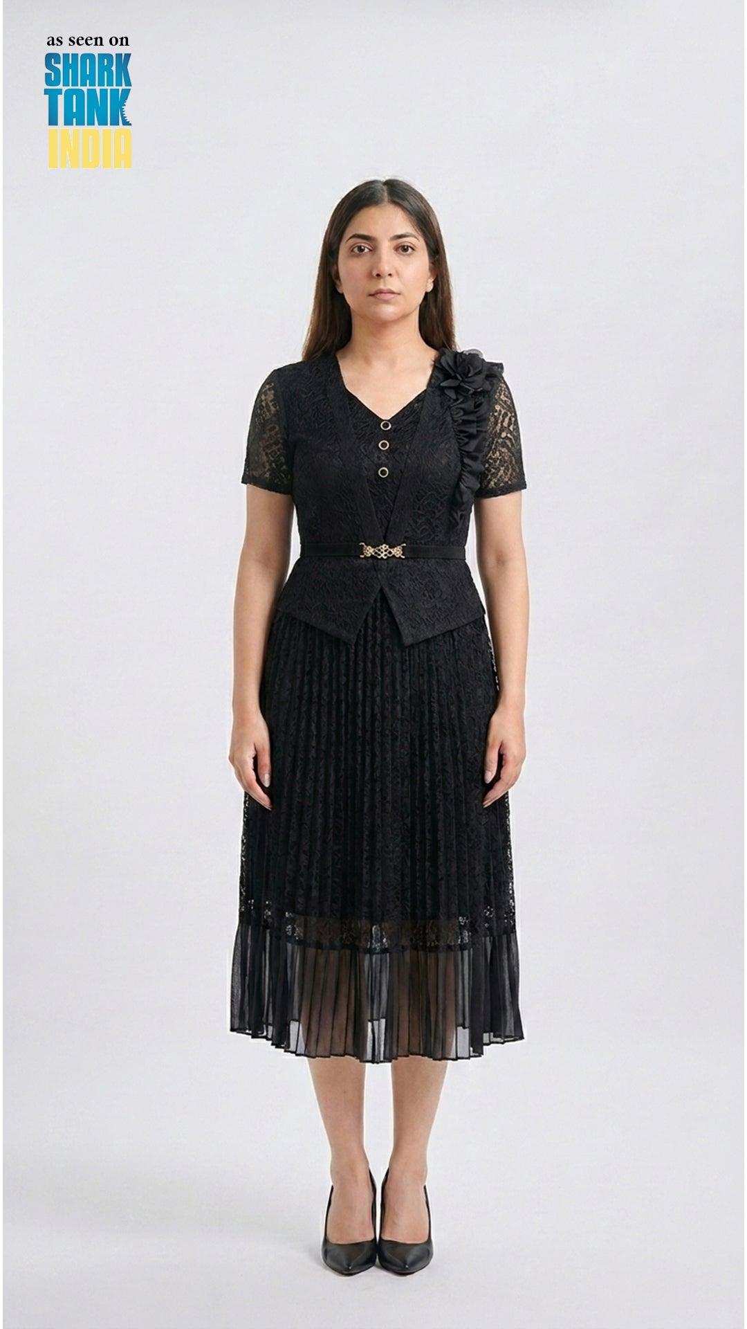 Woman wearing a black dress with lace details on a white background