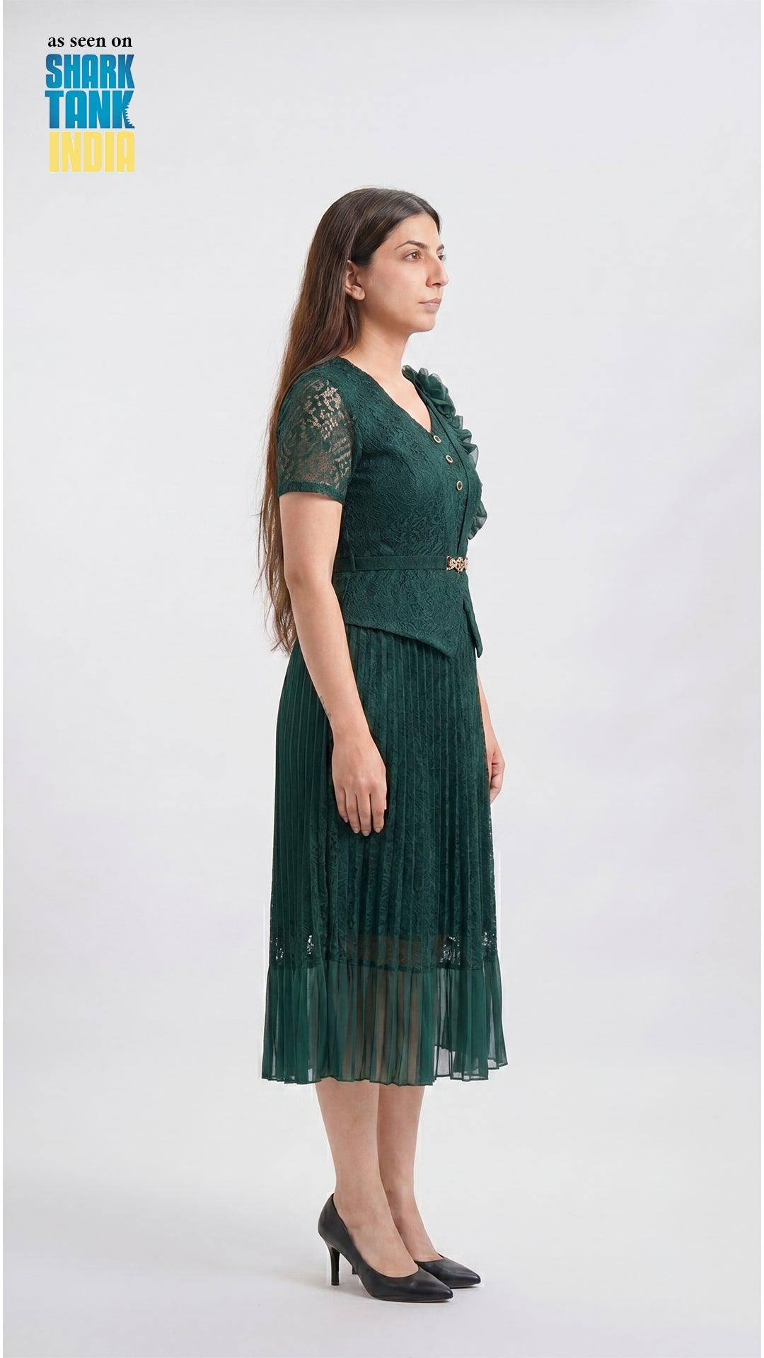 Woman wearing a green dress with a plain white background