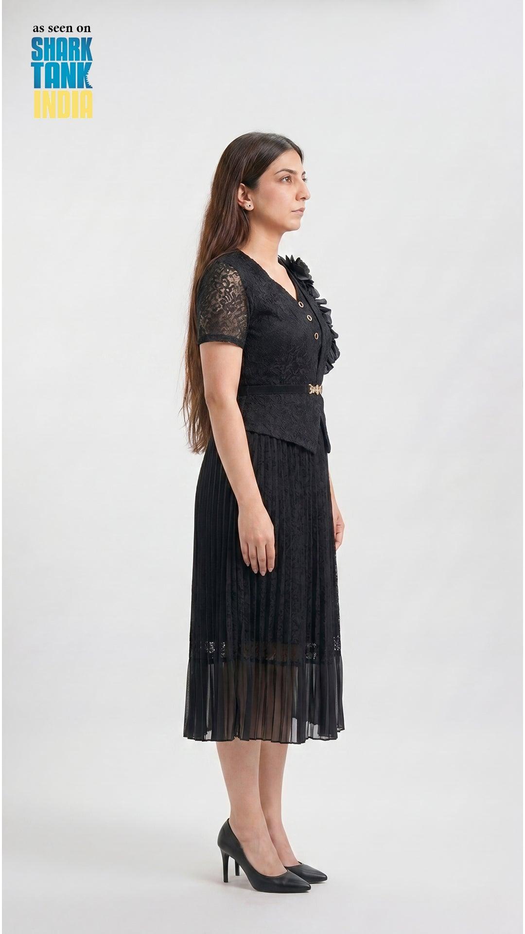 Woman wearing a black dress with floral details on a white background