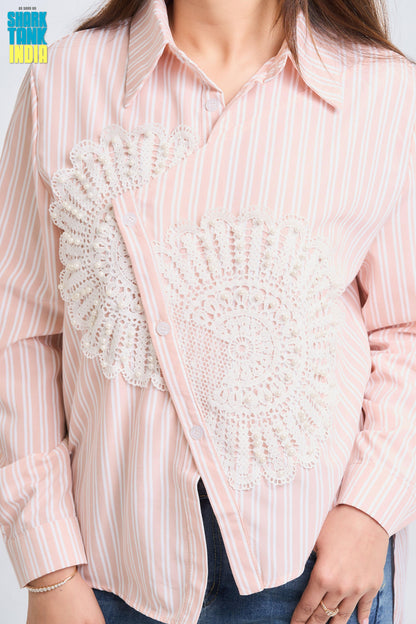 Pink striped shirt with a white lace overlay worn by a person