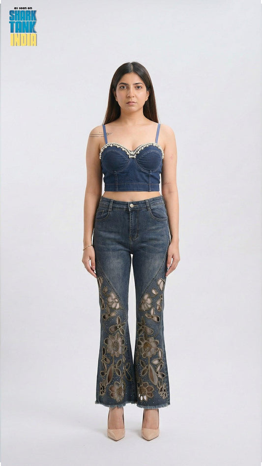 Woman wearing a denim lace top and jeans on a white background