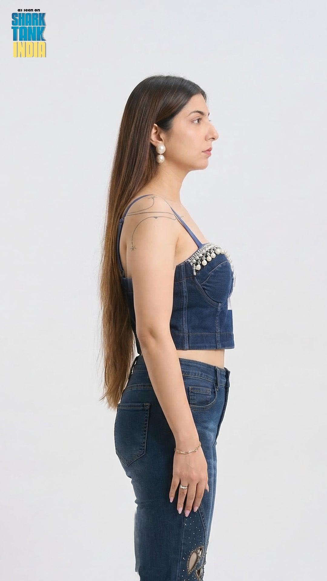 Woman wearing a denim outfit with a white background