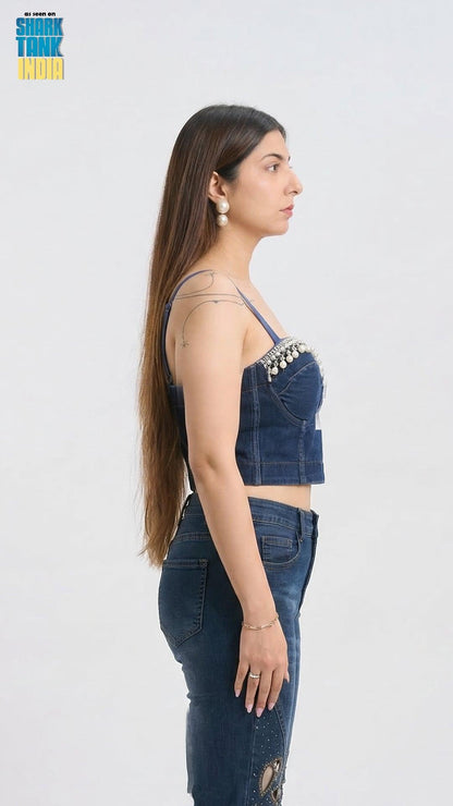 Woman wearing a denim outfit with a white background