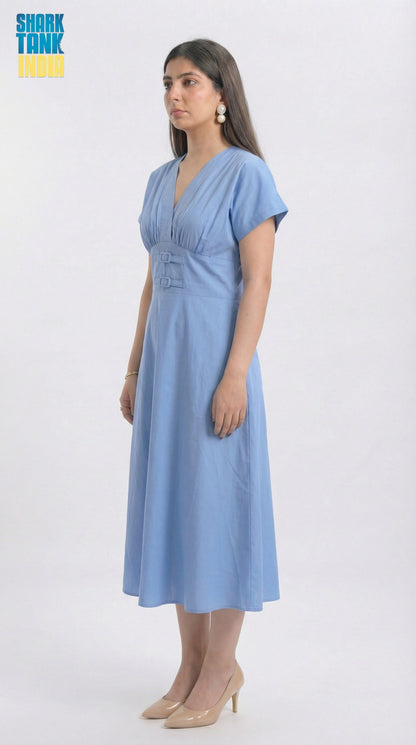 Woman wearing a light blue dress on a white background