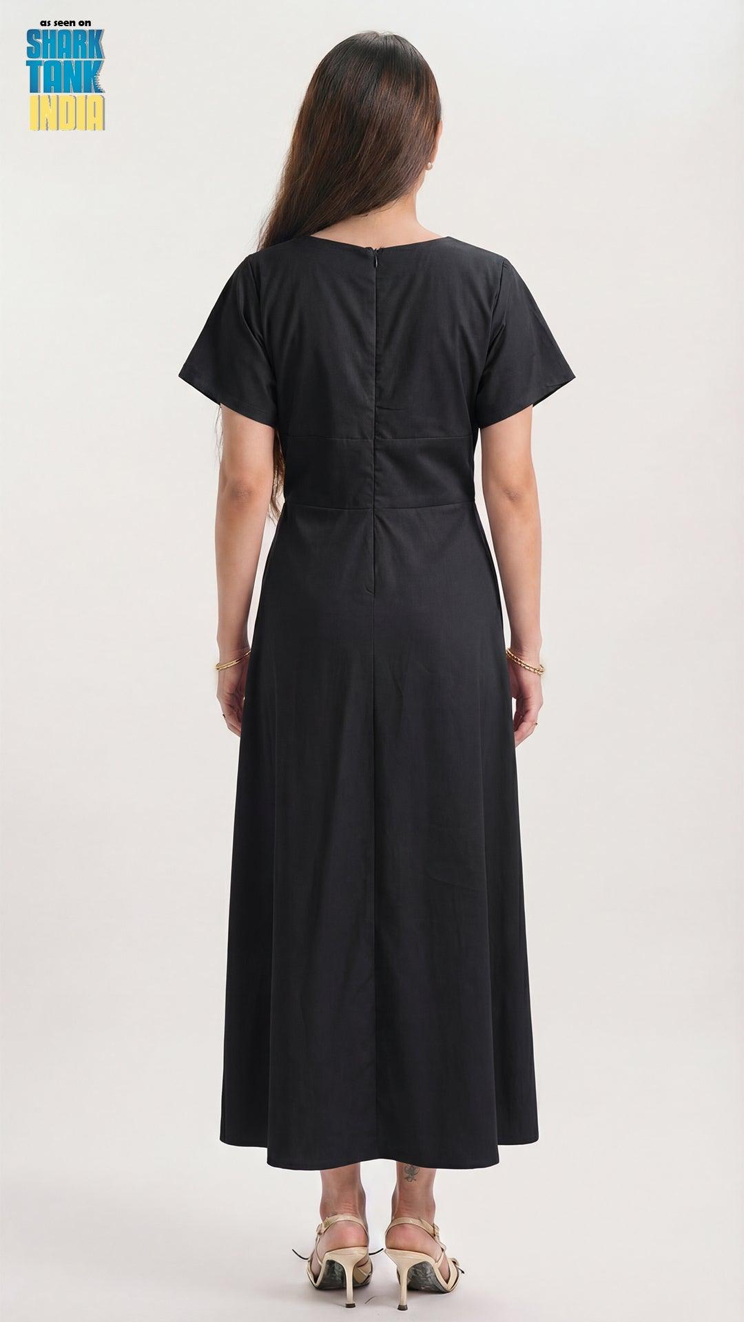 Black dress worn by a person on a white background
